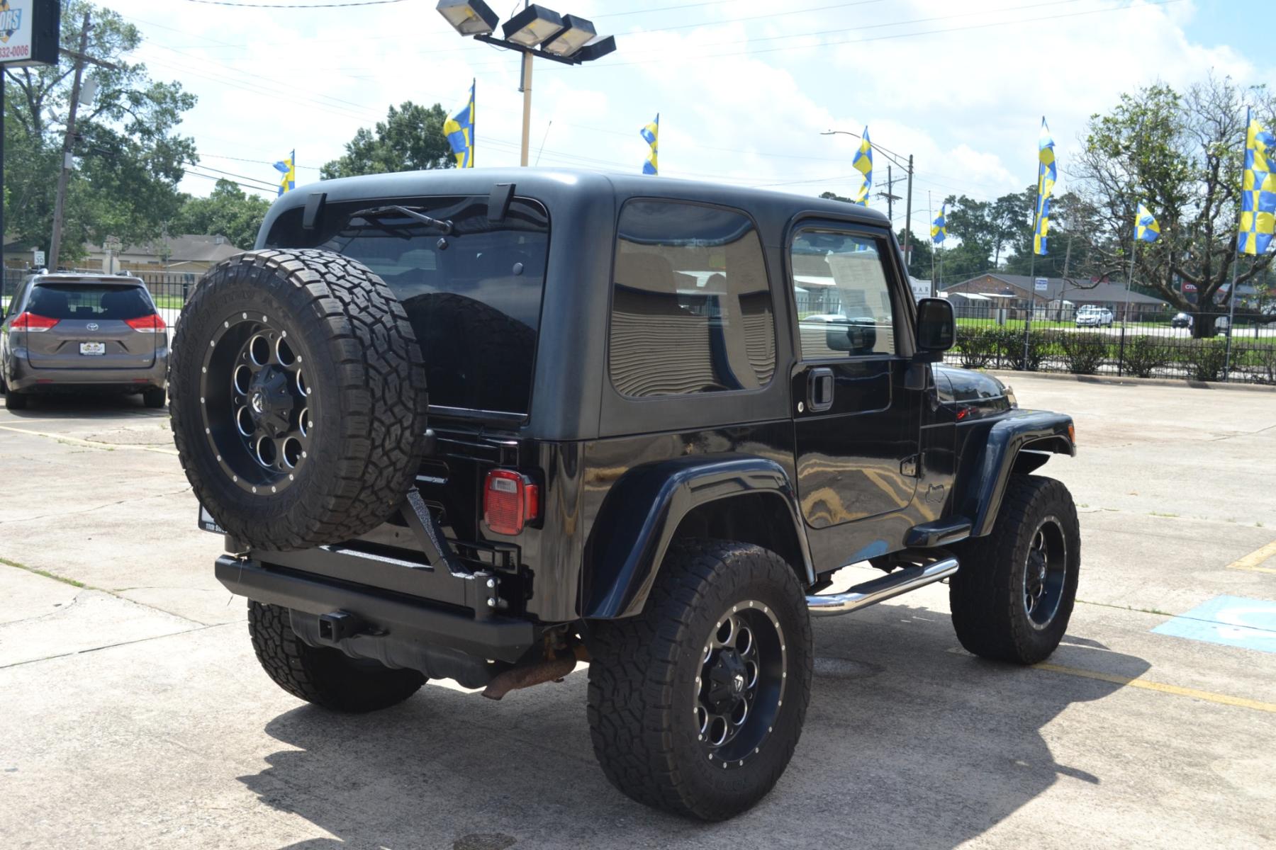 2003 BLACK /BLACK Jeep Wrangler X (1J4FA39S13P) with an 4.0L L6 OHV 12V engine, 4-Speed Automatic | 5-Speed Manual transmission, located at 1355 North 11th Street, Beaumont, 77702, (409) 832-0006, 30.094290, -94.130096 - Photo #4